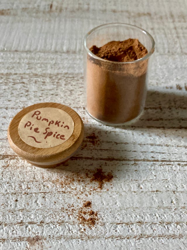 pumpkin pie spice in a spice jar with handwritten label on lid