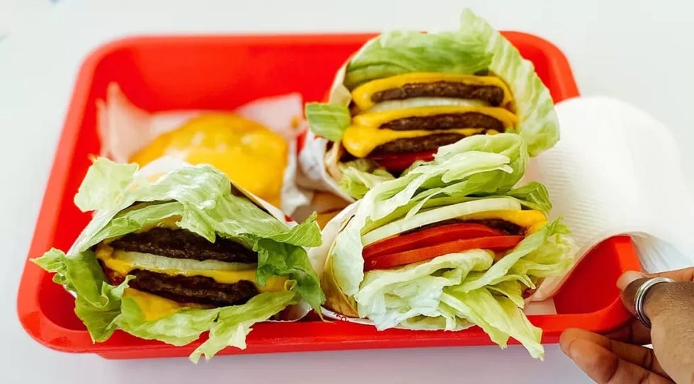 lettucewrapped burgers served on a red tray