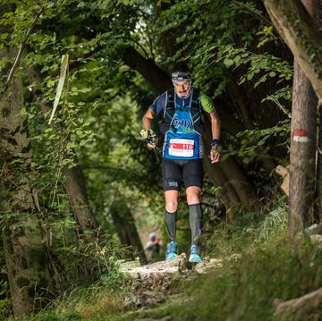 a man running in a forest a man running in a forest