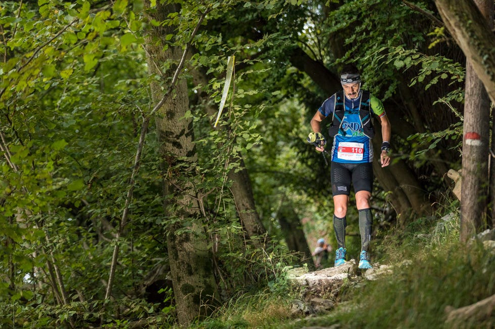 a man running in a forest