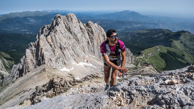 a man climbing a mountain