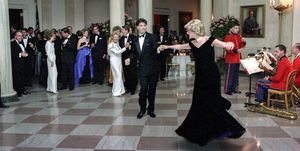 princess diana dancing with john travolta in cross hall at the white house