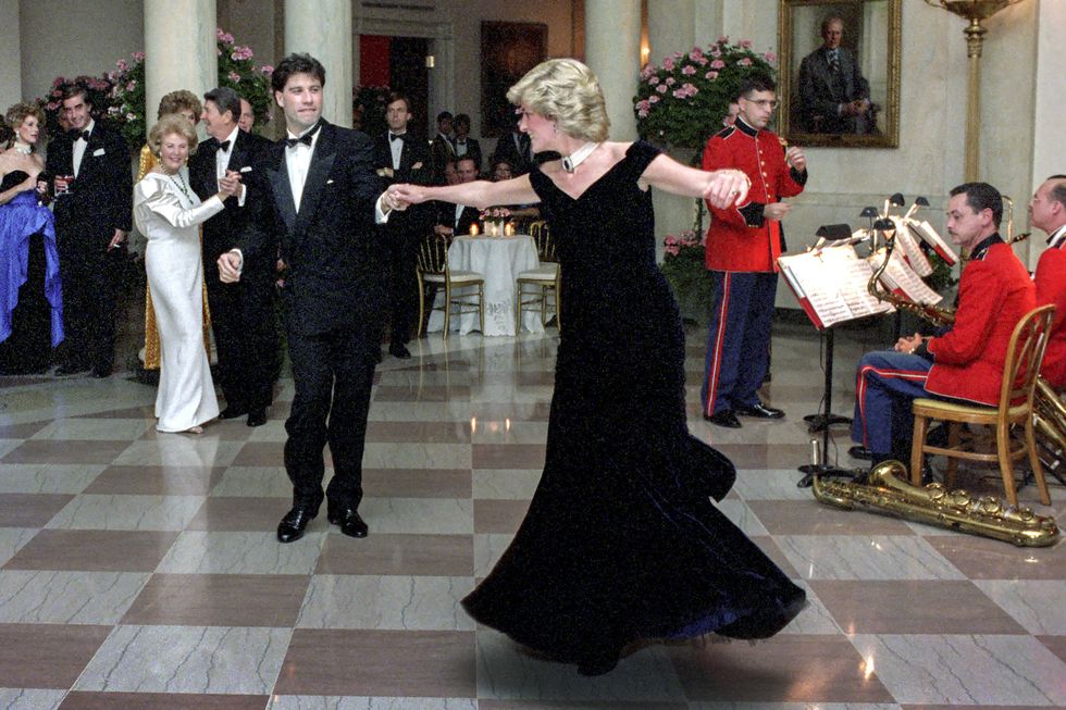 princess diana dancing with john travolta in cross hall at the white house