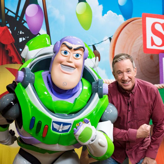 Tim Allen poses with Buzz Lightyear for Toy Story Land