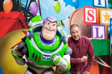 Tim Allen poses with Buzz Lightyear for Toy Story Land