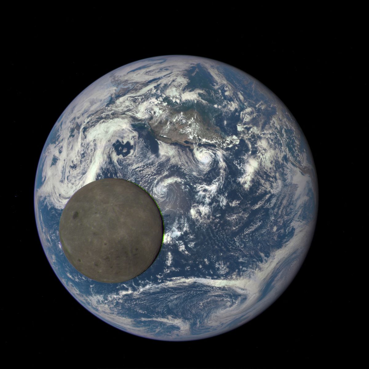 dark side of the moon in front of the earth