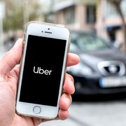 in this photo illustration a uber logo seen displayed