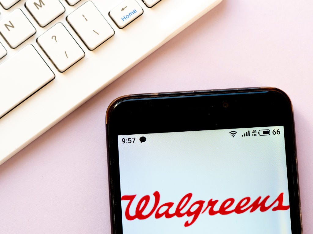 in this photo illustration a walgreens logo seen displayed