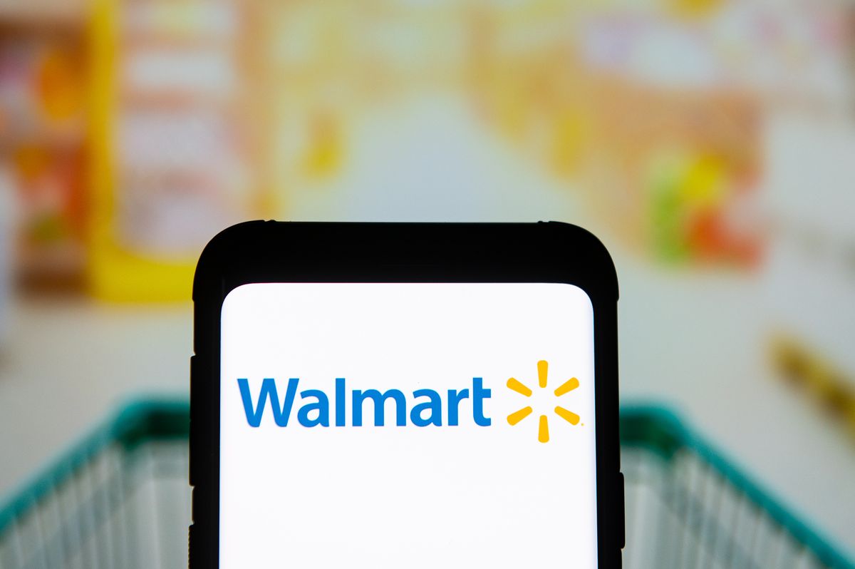 in this photo illustration a walmart logo seen displayed on