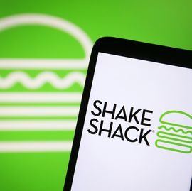 in this photo illustration, shake shack inc. logo is seen on...