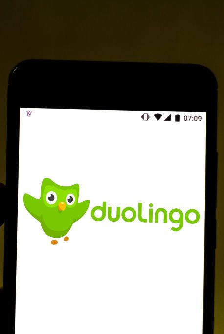 in this photo illustration the duolingo logo is displayed on
