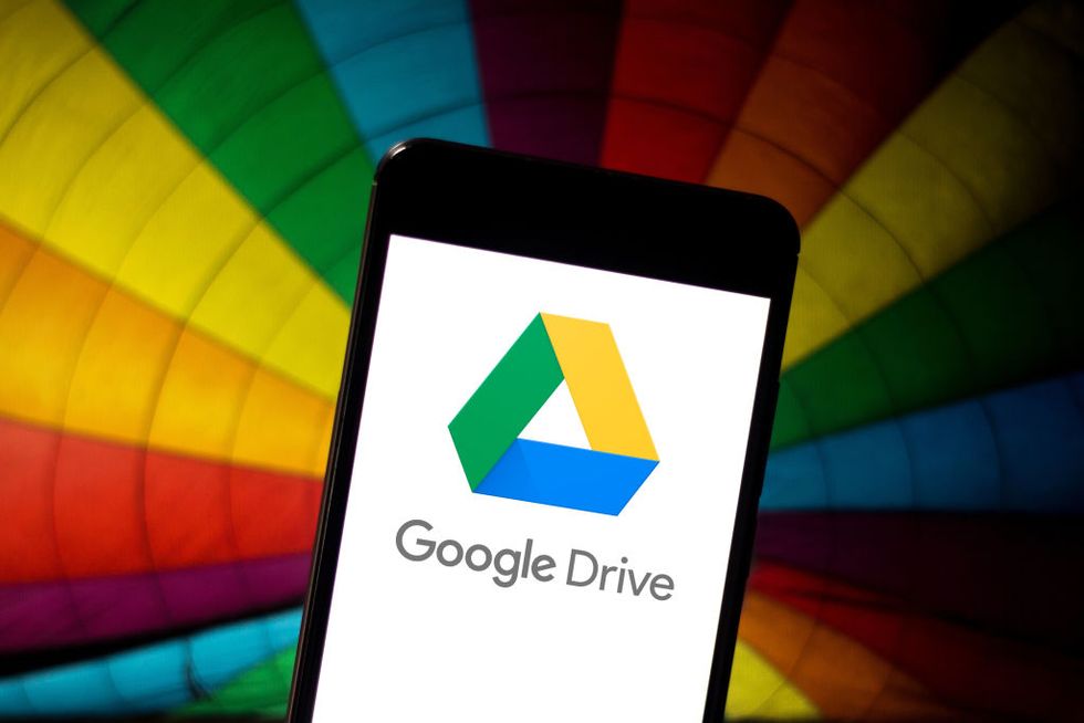 In this photo illustration the Google Drive logo is seen...