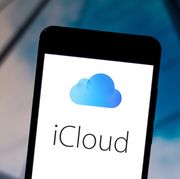 In this photo illustration the iCloud logo is displayed on a...