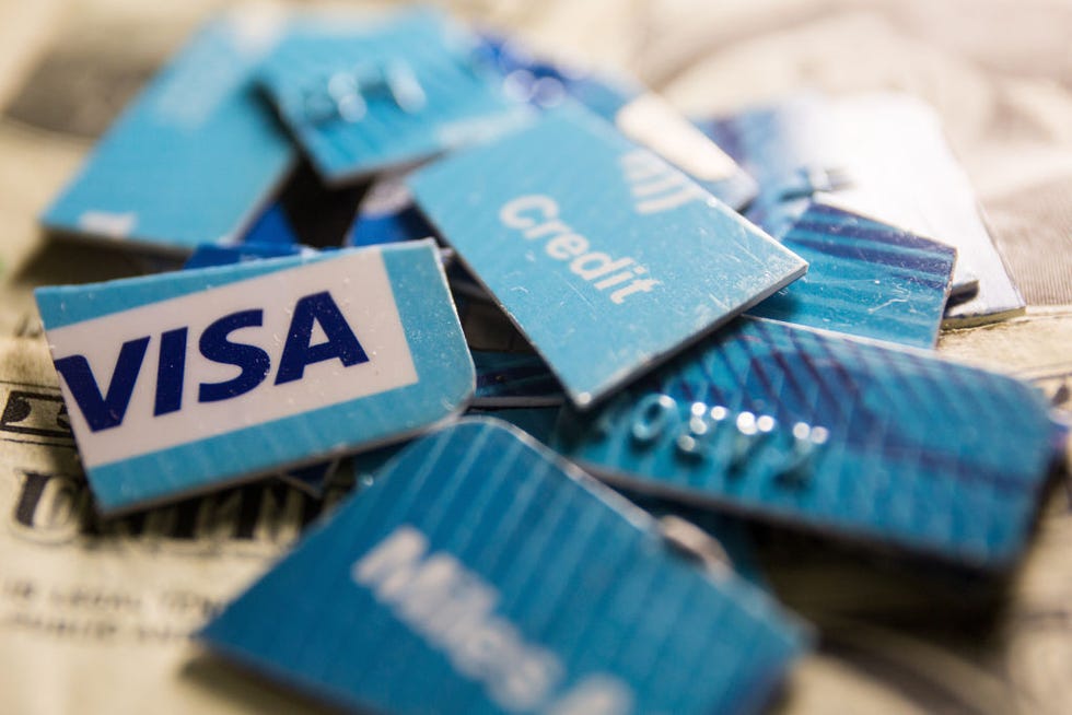 in this photo illustration, visa credit card cut into pieces