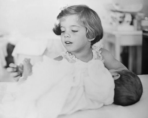 Caroline Kennedy Playing with Toes of Newborn JFK Jr