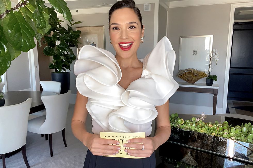 gal gadot in a white blouse in her home virtually hosting the 26th annual critics choice awards