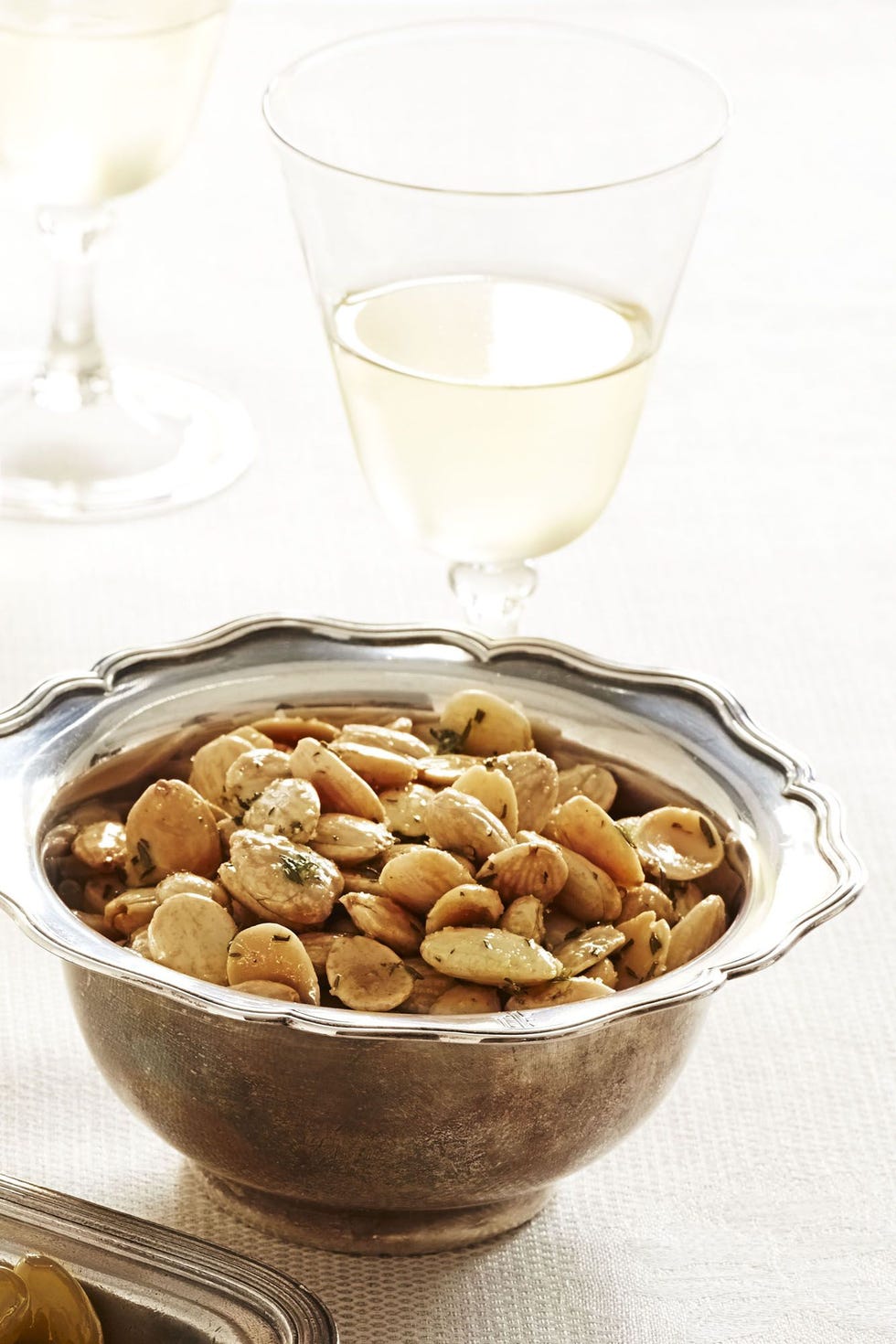 thyme roasted marcona almonds in a glass bowl