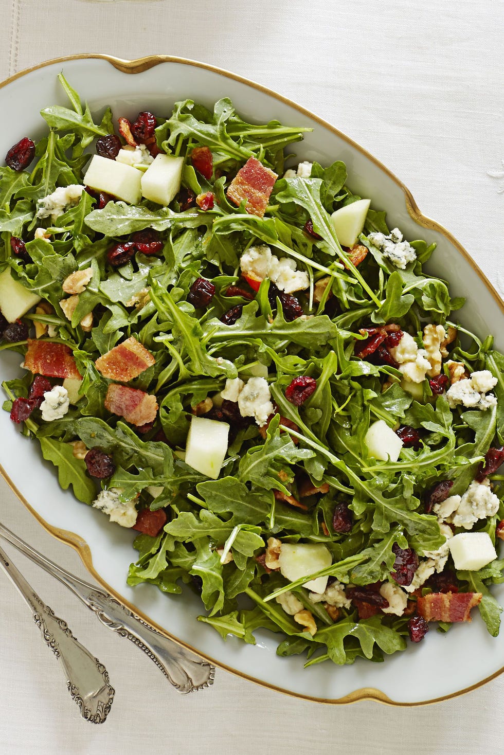 arugula salad with chopped bacon, apple, blue cheese, and dried cranberries