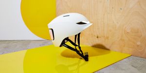 Yellow, Helmet, Personal protective equipment, Design, Floor, Room, Table, Furniture, Sports equipment, Illustration, 