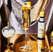 Yellow, Alcohol, Drink, Distilled beverage, Alcoholic beverage, Liqueur, Champagne, Liquid, Glass bottle, Champagne stemware, 