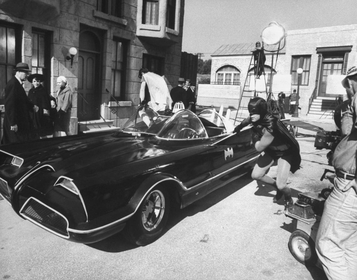 Batman And Robin In The Batmobile by Bettmann