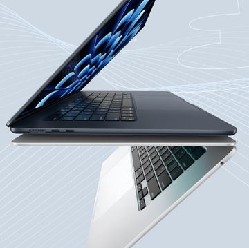 a laptop with a blue pen