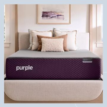 a bed with a purple cover