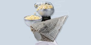 a few silver bowls with popcorn