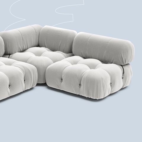 a white couch with a white pillow