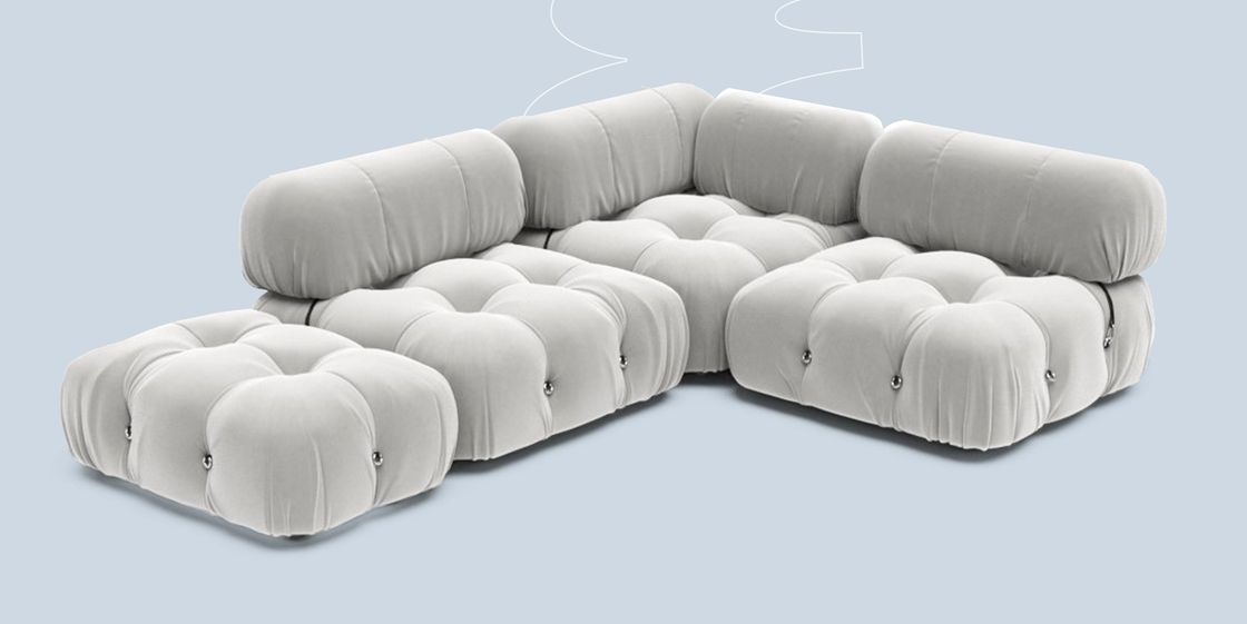 a white couch with a white pillow