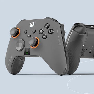 a pair of black and silver video game controllers a pair of black and silver video game controllers