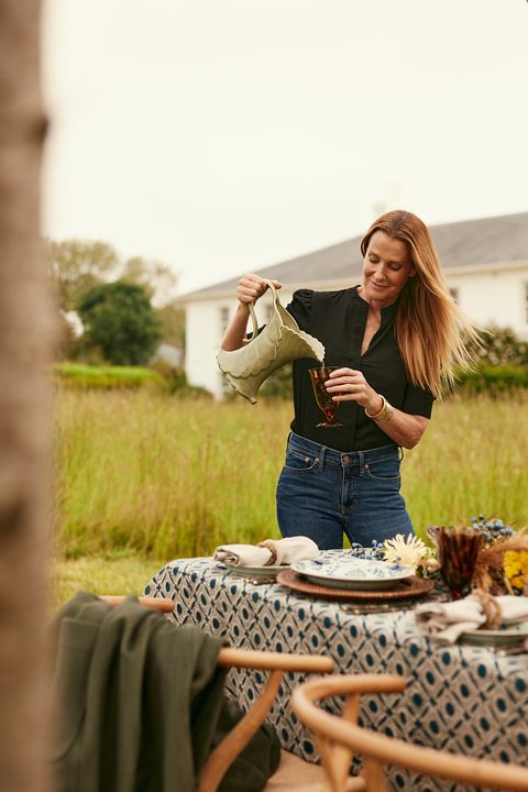 india hicks serving drinks at a fall party
