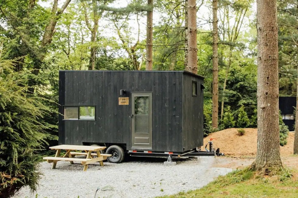 a trailer parked in a wooded area