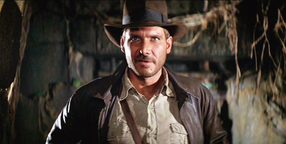 los angeles june 12 the movie indiana jones and the raiders of the lost ark , aka raiders of the lost ark, directed by steven spielberg seen here, harrison ford as indiana jones initial theatrical release june 12, 1981 screen capture a paramount picture photo by cbs via getty images