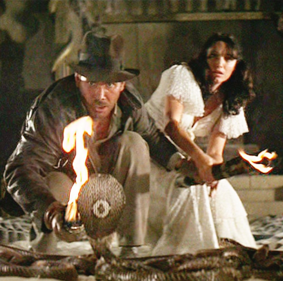 los angeles   june 12 the movie indiana jones and the raiders of the lost ark , aka raiders of the lost ark, directed by steven spielberg  seen here, harrison ford as indiana jones facing a cobra snake in the well of the souls chamber  in background, karen allen as marion ravenwood  initial theatrical release june 12, 1981  screen capture a paramount picture photo by cbs via getty images in indiana jones movies in order