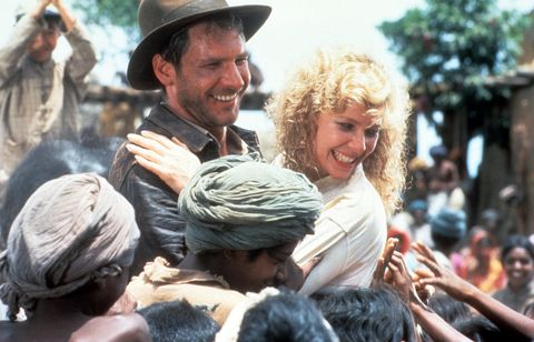 harrison ford and kate capshaw are greeted by children in a scene from the film indiana jones and the temple of doom, 1984 photo by paramountgetty images in indiana jones movies in order