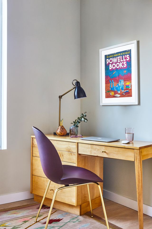home office with wood desk and purple chair
