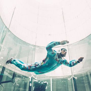 indoors skydiving one young man practising freefall simulation