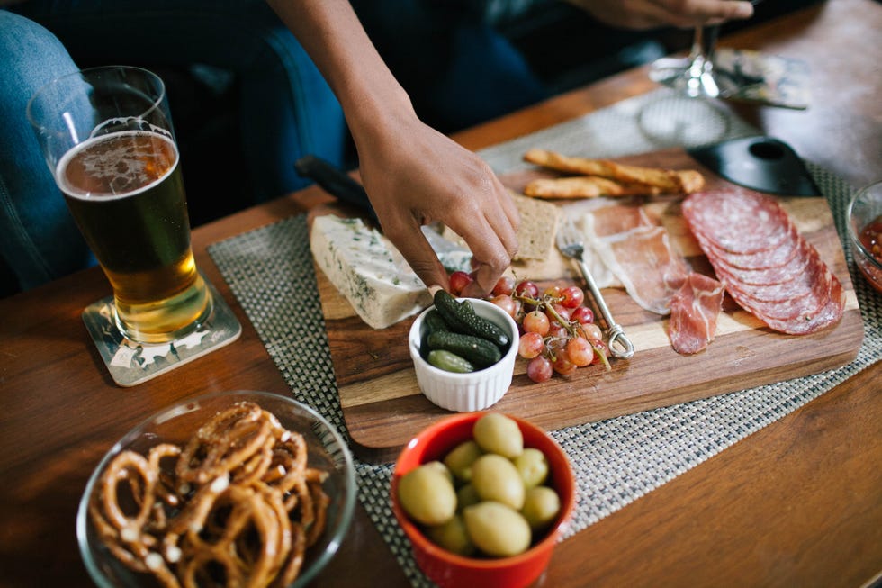 indulging in a charcuterie at a house party