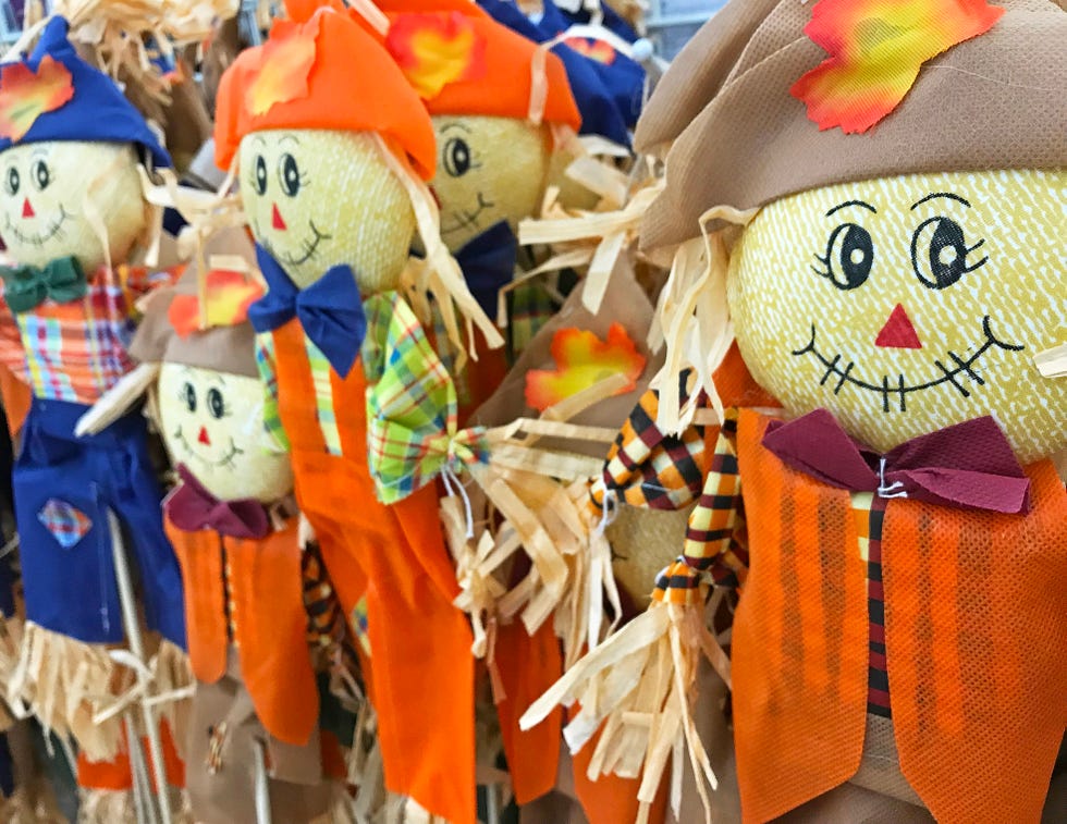 Inexpensive Scare crow halloween decorations on display for sale at a thrift store