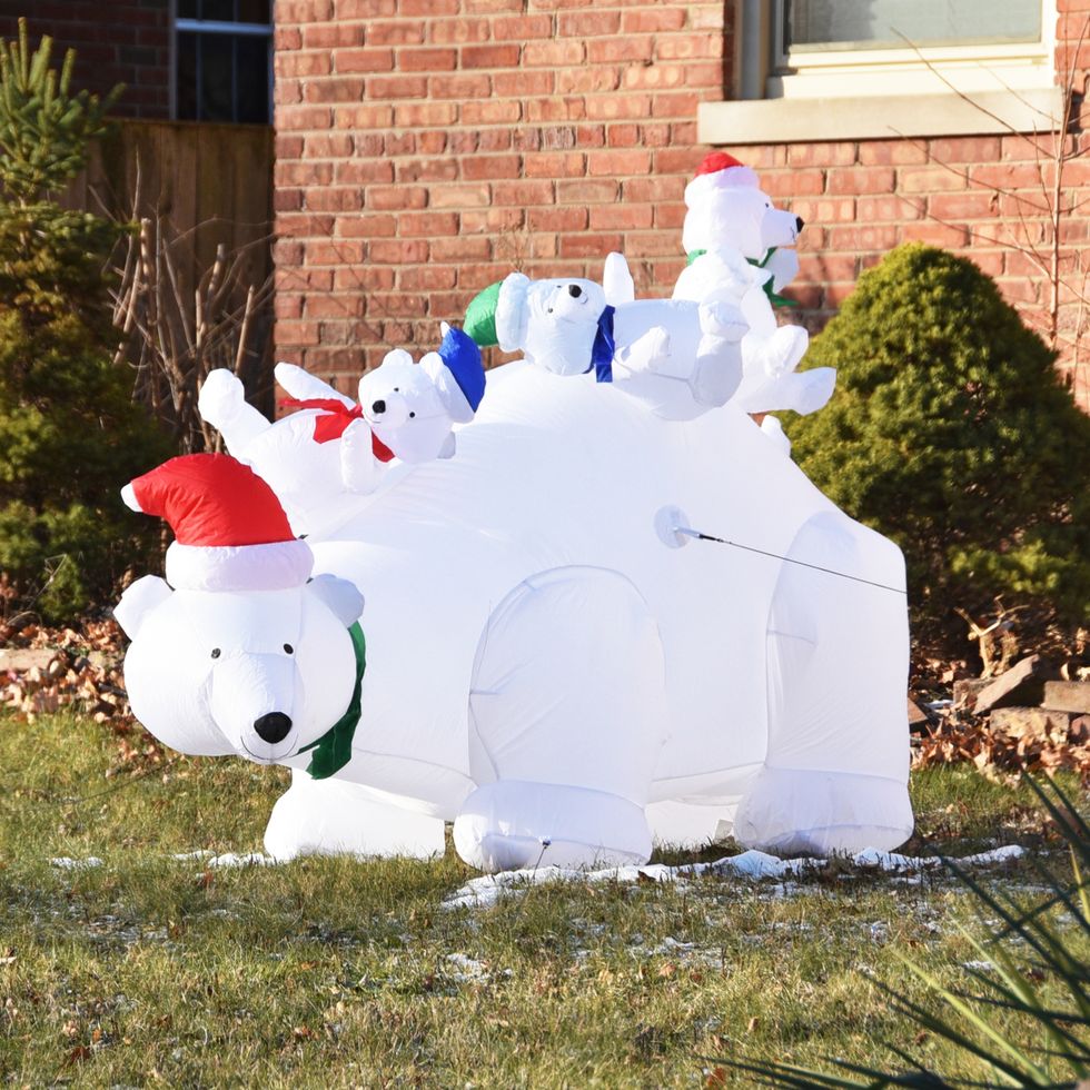 inflatable polar bear family wearing santa hats