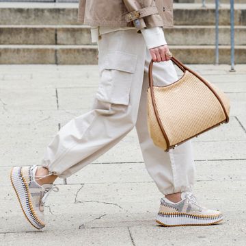 a woman walks in chloe sneakers to illustrate a guide to the most comfortable sneakers 2024