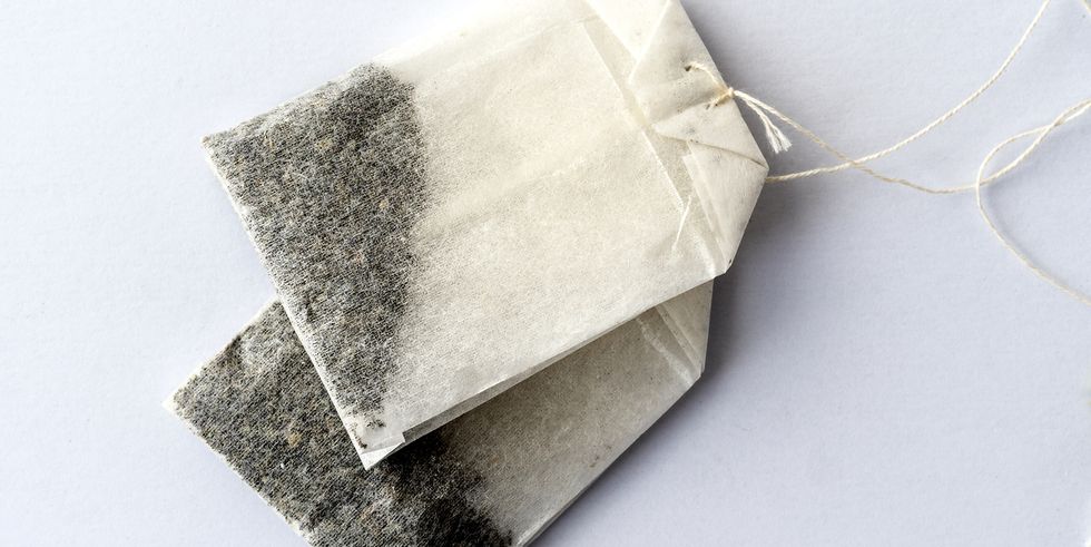 infusion of grasses of tea tea bag , on a white background