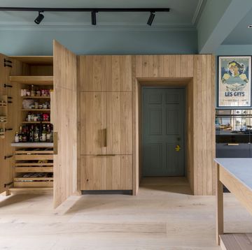 kitchen with large wooden pantry built around doorframe