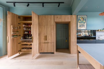 kitchen with large wooden pantry built around doorframe