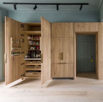 kitchen with large wooden pantry built around doorframe