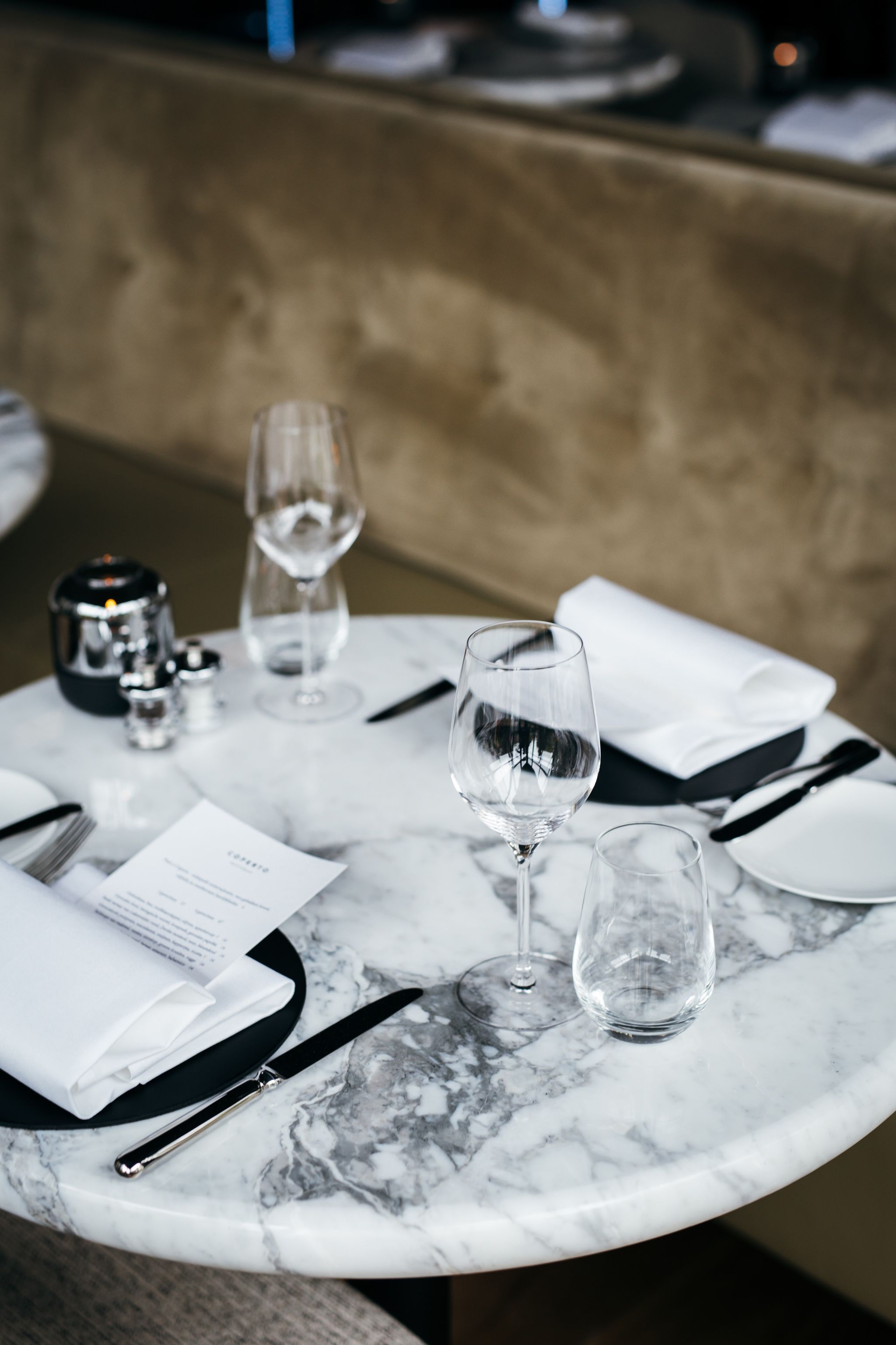 Table, Restaurant, Rehearsal dinner, Black-and-white, Tablecloth, Textile, Tableware, Photography, Glass, À la carte food, 
