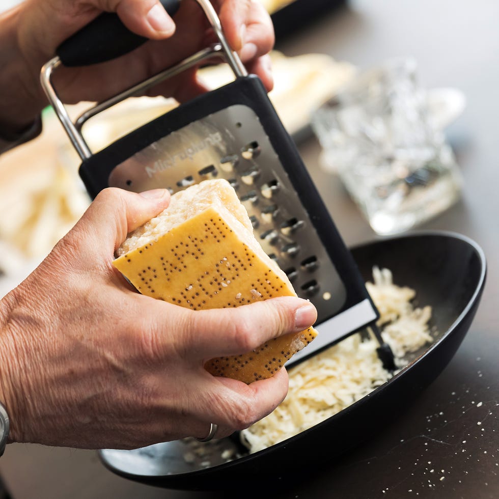 grating parmesan on an old italian grater. fresh is best.