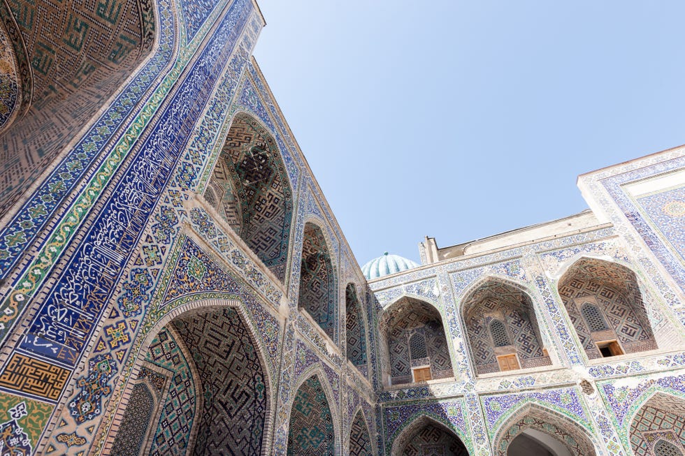 Inner Facades And Mosaics Of The Tilya-Kori Madrasah At The Registan -  A Public Square In The Heart Of The Ancient City Of Samarkand In Uzbekistan