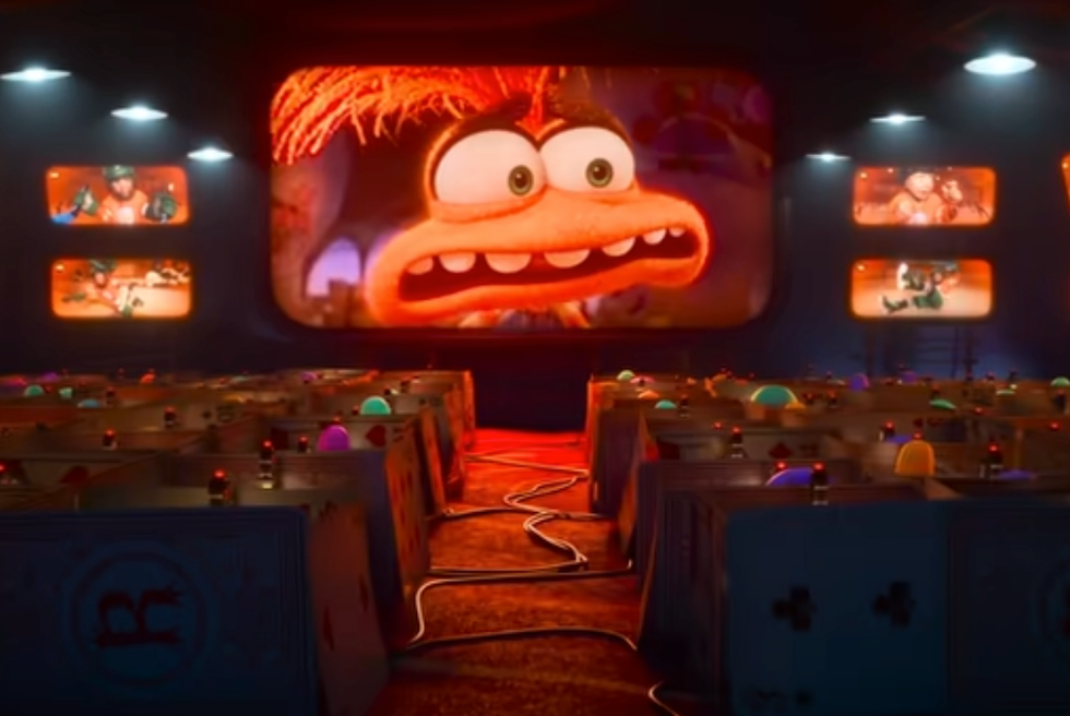 anxiety's face shows up on a big screen in a scene from inside out 2